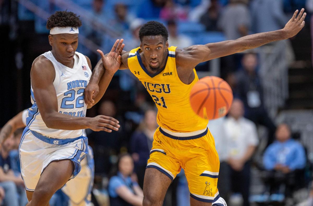 North Carolina forward Ven-Allen Lubin (22) forces a turnover by Johnson C. Smith’s Asa White (21) during the first half on Sunday, October 27, 2024 at the Smith Center in Chapel Hill, N.C.