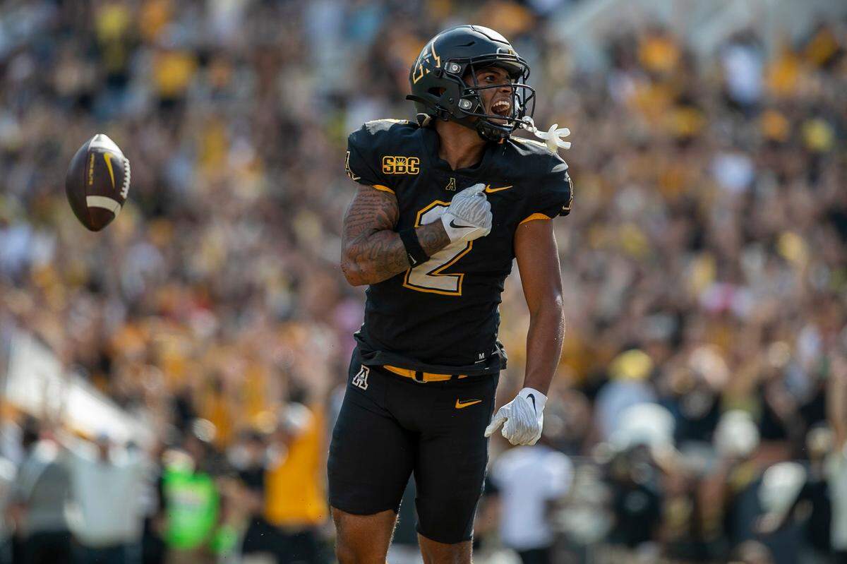 Appalachian State’s Kaedin Robinson (2) reacts after scoring a touchdown on a 26-yard pass from quarterback Chase Brice with :09 second to play in the game on Saturday, September 3, 2022 at Kidd Brewer Stadium in Boone, N.C.