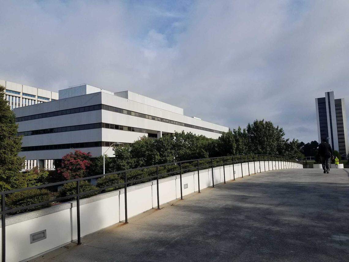 The North Carolina Legislative Office Building, on left, is across a pedestrian bridge from the Legislative Building in downtown Raleigh. The LOB holds lawmaker offices and committee rooms of the General Assembly.