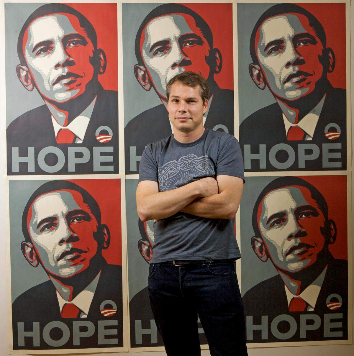 Artist Shepard Fairey poses for a picture with his Barack Obama Hope artwork in Los Angeles on Jan. 12, 2009.