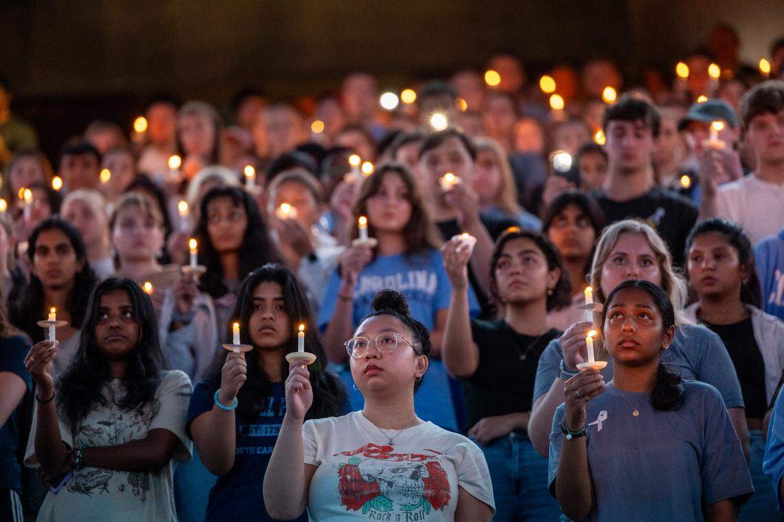 UNC-Chapel Hill students, faculty and family hold a candlelight vigil Wednesday, Aug 30, 2023 at the Dean Smith Center in honor of professor Zijie Yan who was shot and killed on campus on Monday.