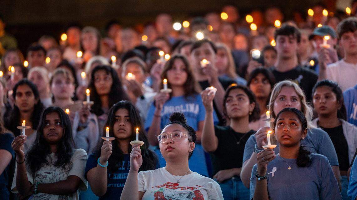 ‘We will never forget.’ UNC comes together to mourn slain professor at candlelight vigil