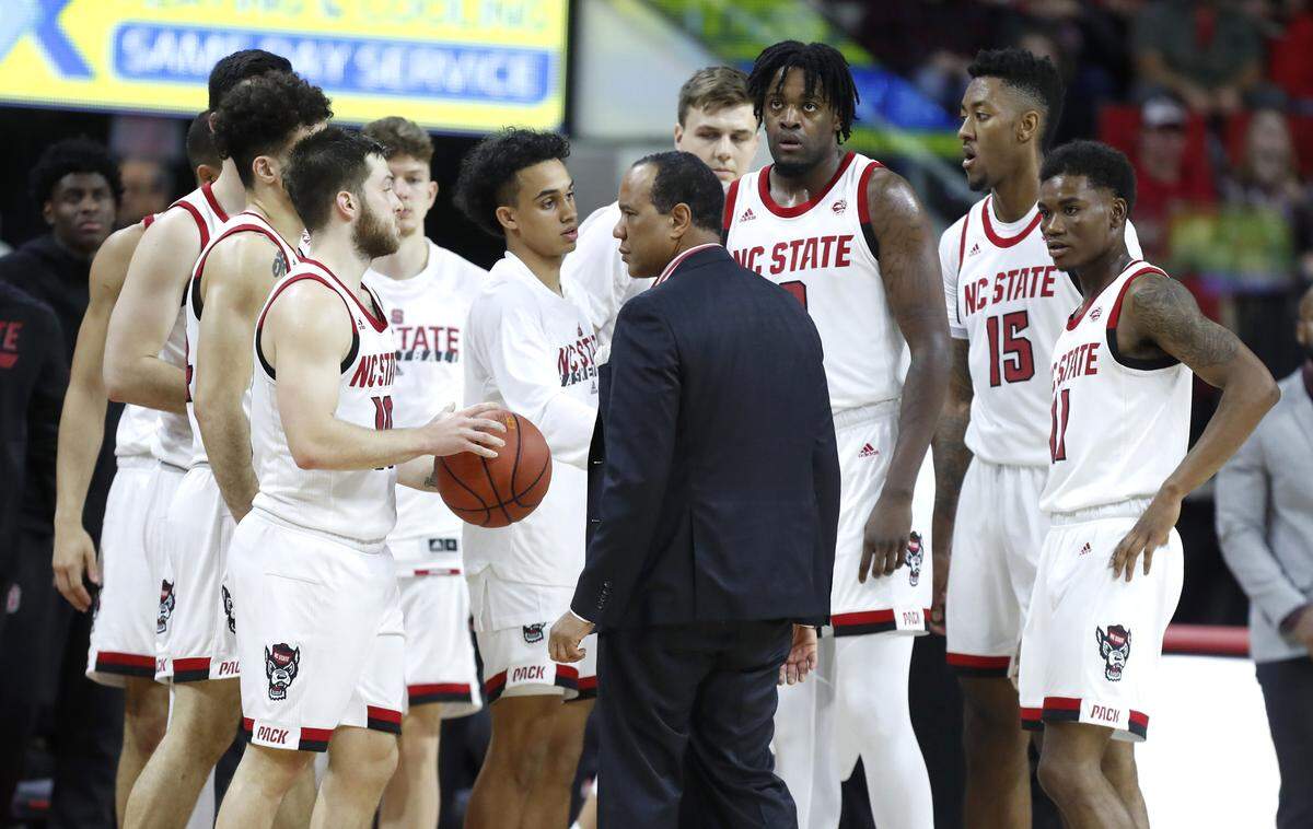 N.C. State head coach Kevin Keatts talks with his team during a timeout during the Wolfpack’s game against Appalachian State at PNC Arena in Raleigh, N.C., Sunday, December 29, 2019.