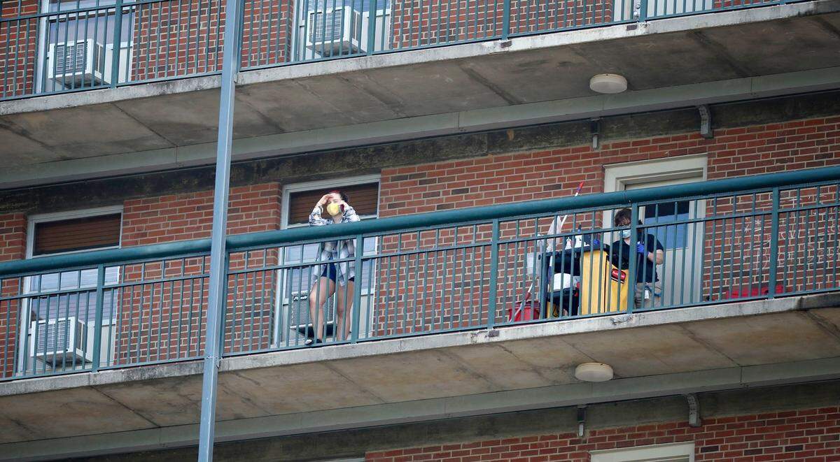 A person hangs out at the Hinton James residence hall on the campus of UNC in Chapel Hill, N.C., Tuesday, August 18, 2020.