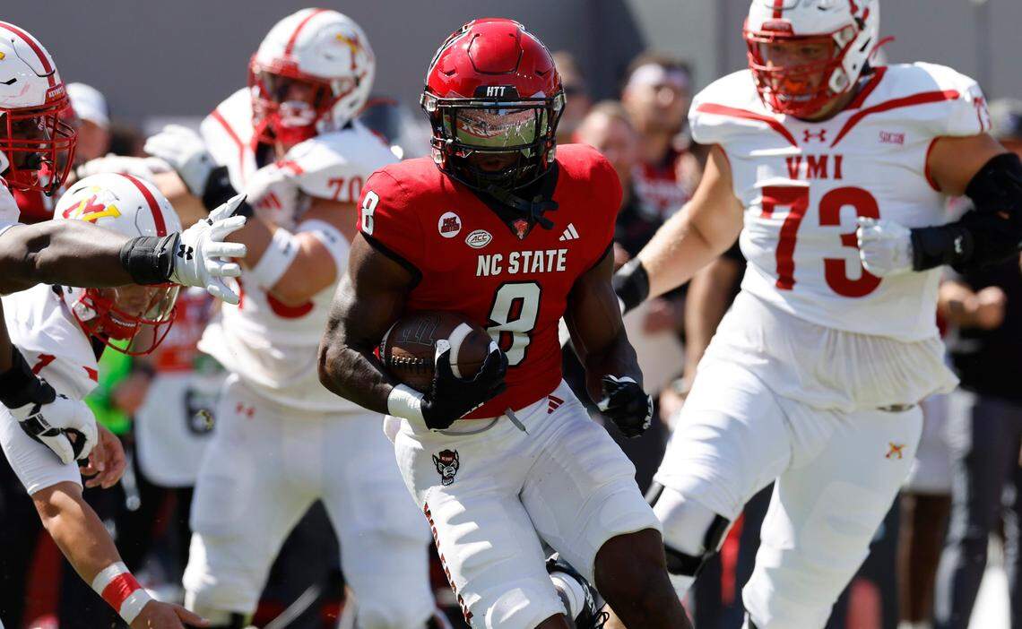 N.C. State defensive back Robert Kennedy (8) returns an interception for a touchdown during the first half of N.C. State’s game against VMI at Carter-Finley Stadium in Raleigh, N.C., Saturday, Sept. 16, 2023.