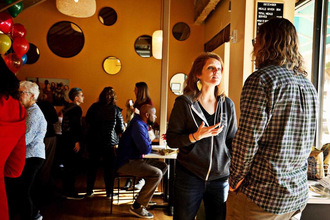 Maggie Kane, the founder of the pay-what-you-can cafe A Place at the Table in downtown Raleigh, chats with a customer, January 8, 2019, during the cafe’s one year anniversary.