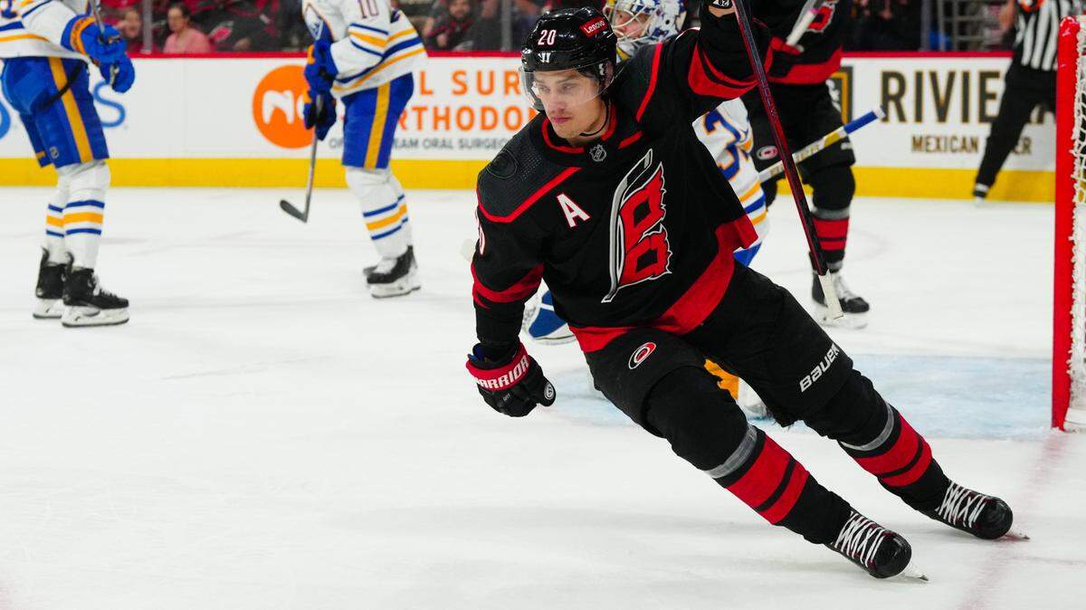 Dec 2, 2023; Raleigh, North Carolina, USA; Carolina Hurricanes center Sebastian Aho (20) scores a goal against the Buffalo Sabres during the first period at PNC Arena. Mandatory Credit: James Guillory-USA TODAY Sports