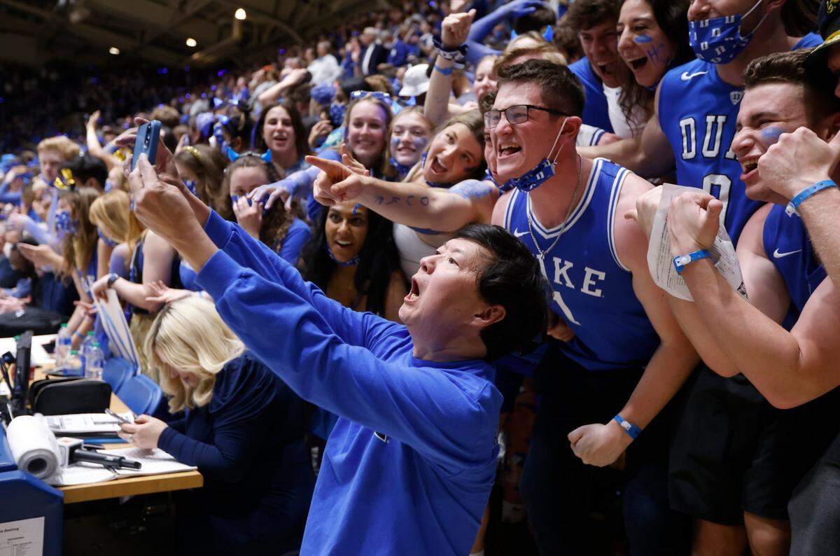 Ken Jeong takes a selfie with some Cameron Crazies before Dukes game against UNC at Cameron Indoor Stadium in Durham, N.C., Saturday, March 5, 2022.