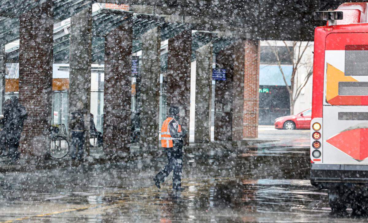 Snow falls as seen at the GoRaleigh station in downtown Raleigh early Wednesday afternoon, Feb. 19, 2025.