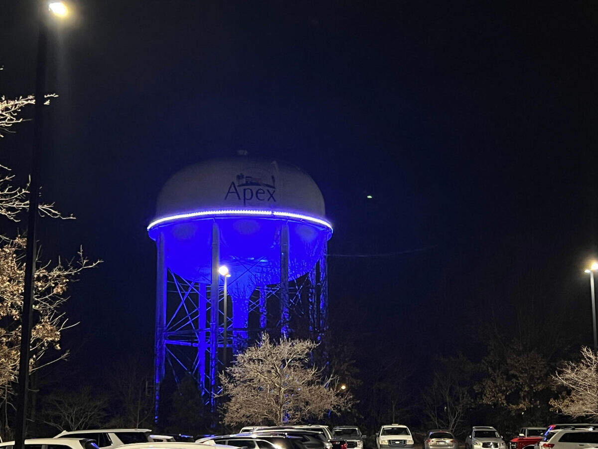 The lights on the water tower on Hunter Street in Apex, NC, were lit purple to signal a healing community after two women and a dog were shot and killed on Jan. 15, 2024.