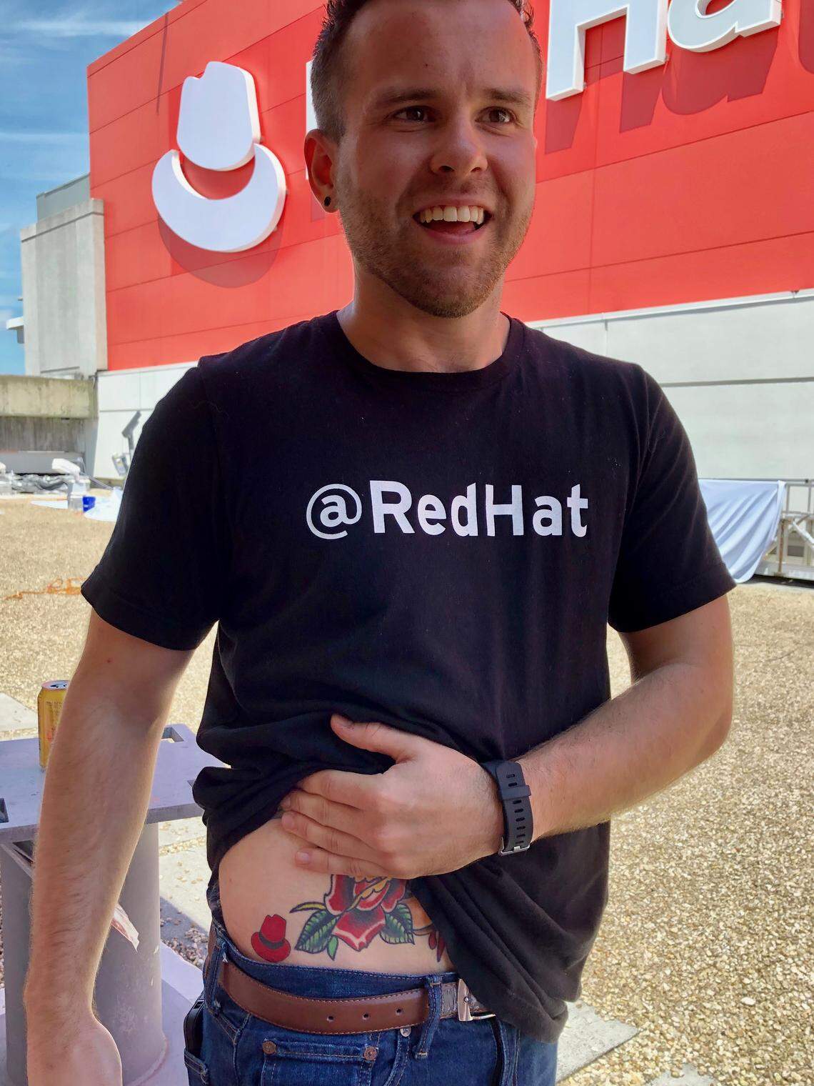 Michael Chadwick, who does corporate digital marketing for Red Hat, said the new logo was his 16th tattoo. He decided to get the new logo inked onto his body despite only working there for a few months. “I am a big believer in the open-source mission of Red Hat,” he said.