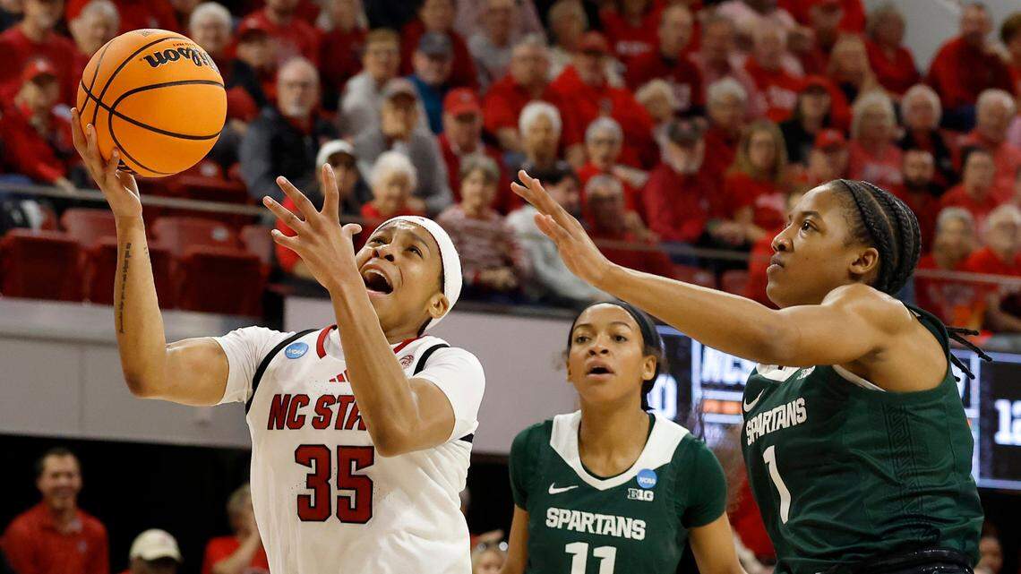 N.C. State’s Zoe Brooks drives past Michigan State’s Jocelyn Tate and Jaddan Simmons during the first half of the Wolfpack’s second round NCAA Tournament game on Monday, March 24, 2025, at Reynolds Coliseum in Raleigh, N.C.