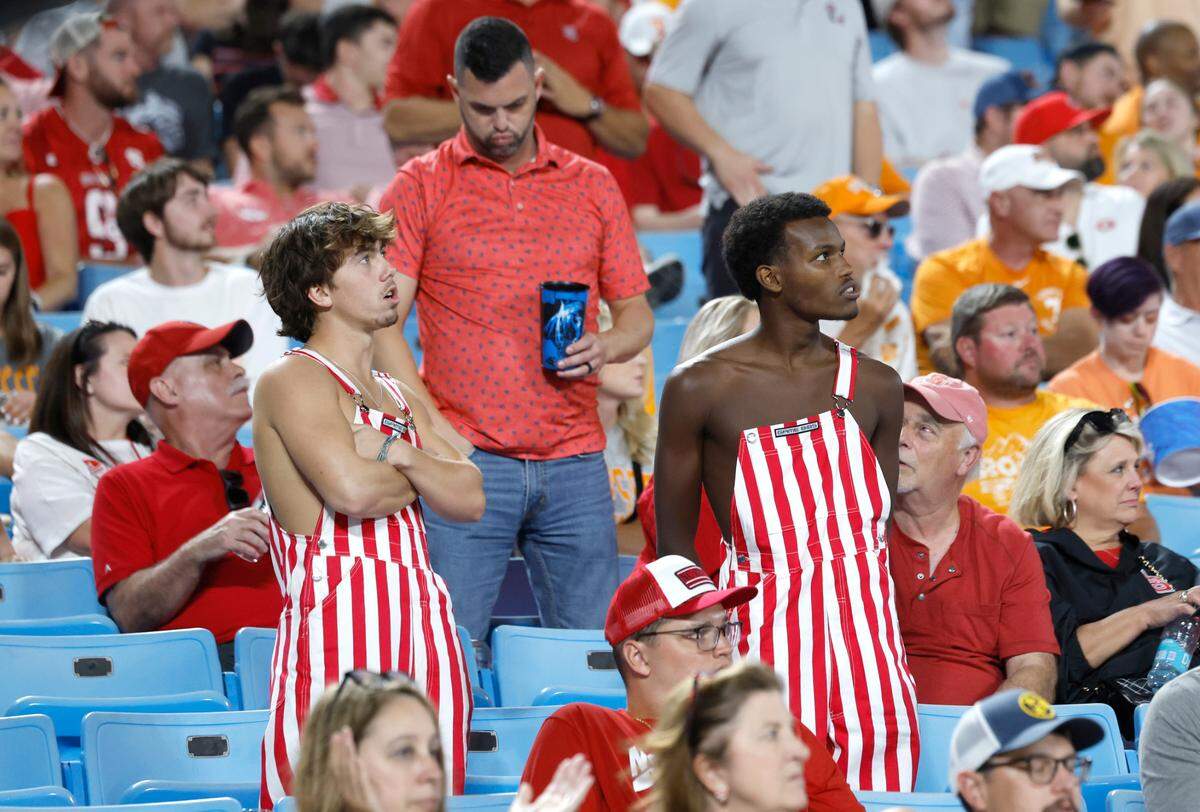 Wolfpack fans watch during the second half of Tennessee’s 51-10 victory over N.C. State in the Duke’s Mayo Classic at Bank of America Stadium in Charlotte, N.C., Saturday, Sept. 7, 2024.