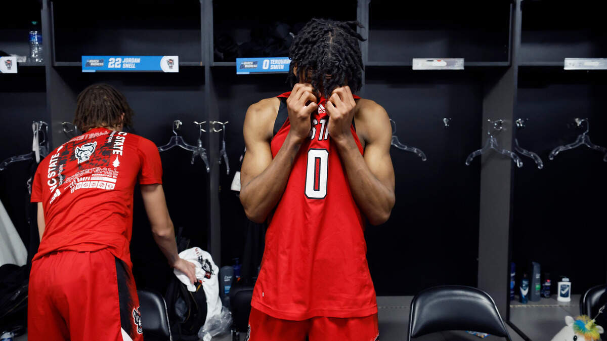 N.C. State’s Terquavion Smith (0) stands in front of his locker after Creighton’s 72-63 victory over N.C. State in the first round of the NCAA Tournament at Ball Arena in Denver, Colo., Friday, March 17, 2023.