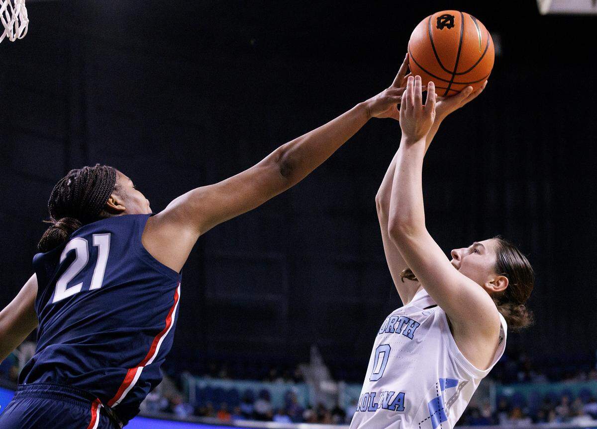 UConn’s Sarah Strong contests a shot by North Carolina’s Lanie Grant during the second half of the Tar Heels’ 69-58 loss on Friday, Nov. 15, 2024, at First Horizon Coliseum in Greensboro, N.C.