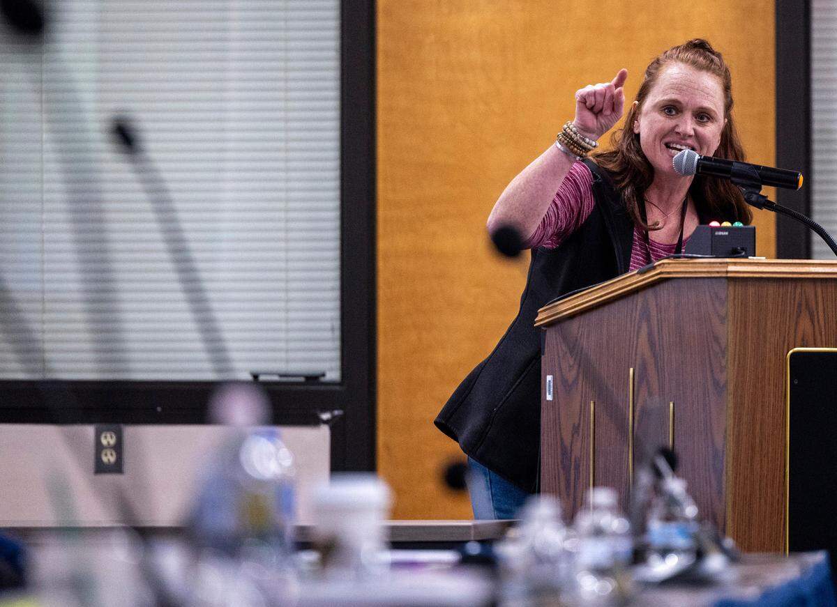 Katie McGonnell, a first grade teacher at Durham’s Little River K-8 School, addresses the Durham County Board of Education during a board meeting February 2, 2024, at the Staff Development Center in Durham. DPS struggled to resolve salary issues that plunged the district into chaos. The issues stem from an accounting error that resulted in administration withdrawing raises promised to 1,300 school staff, prompting protests and strikes since mid-January.
