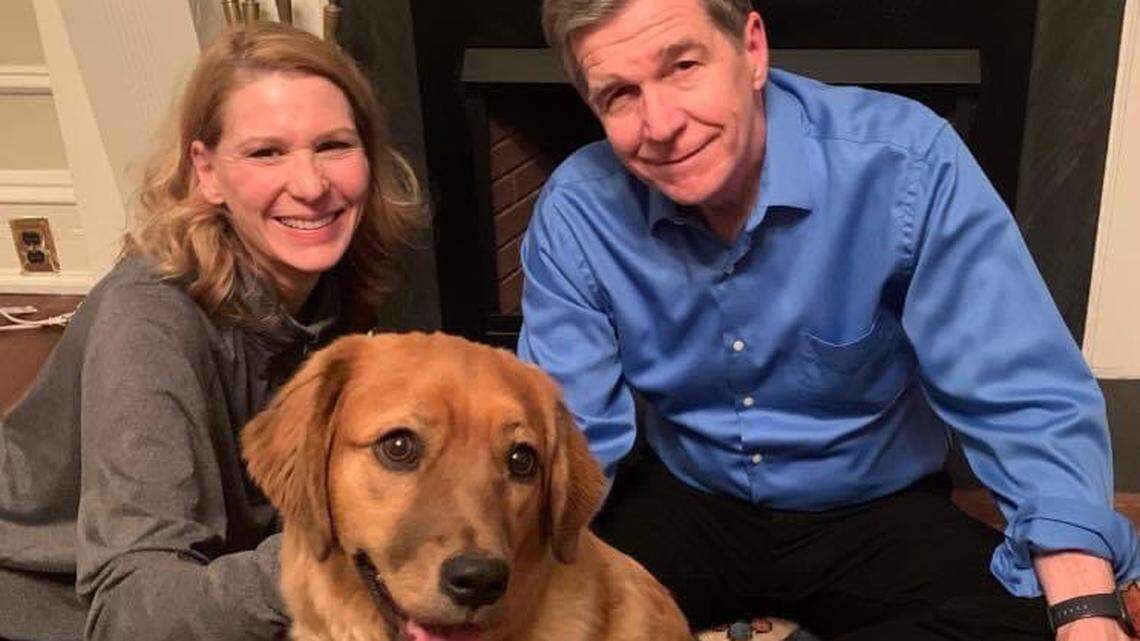 North Carolina First Lady Kristin Cooper, left, and Gov. Roy Cooper, right, welcomed a new first pet to the family, a rescue dog named Violet.