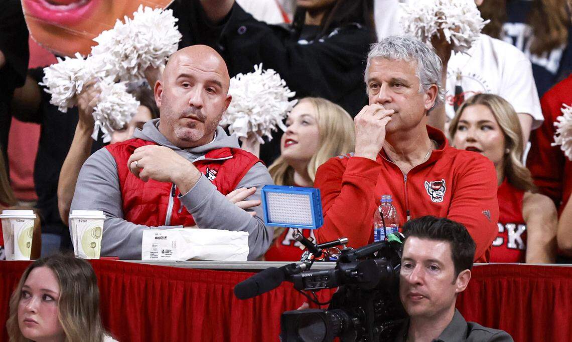 N.C. State athletic director Boo Corrigan, right, and Wolfpack Club Executive Director Ben Broussard watch the Wolfpack’s game against Pitt at the Lenovo Center in Raleigh, N.C., Wednesday, March 5, 2025.