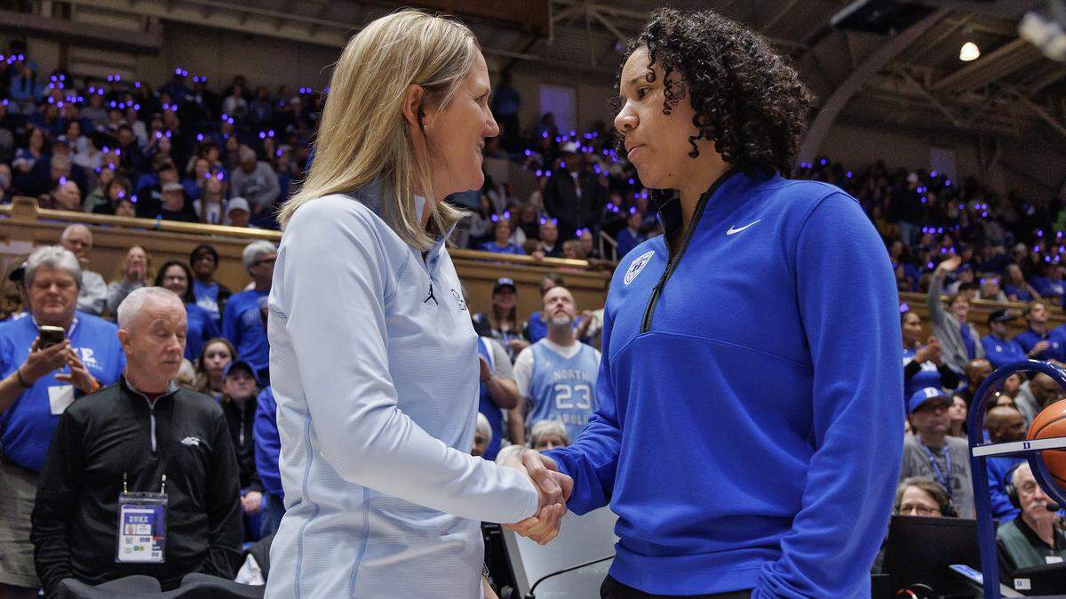 North Carolina head coach Courtney Banghart and Duke head coach Kara Lawson share a word prior to their teams’ matchup on Sunday, Feb. 15, 2026, at Cameron Indoor Stadium in Durham, N.C.
