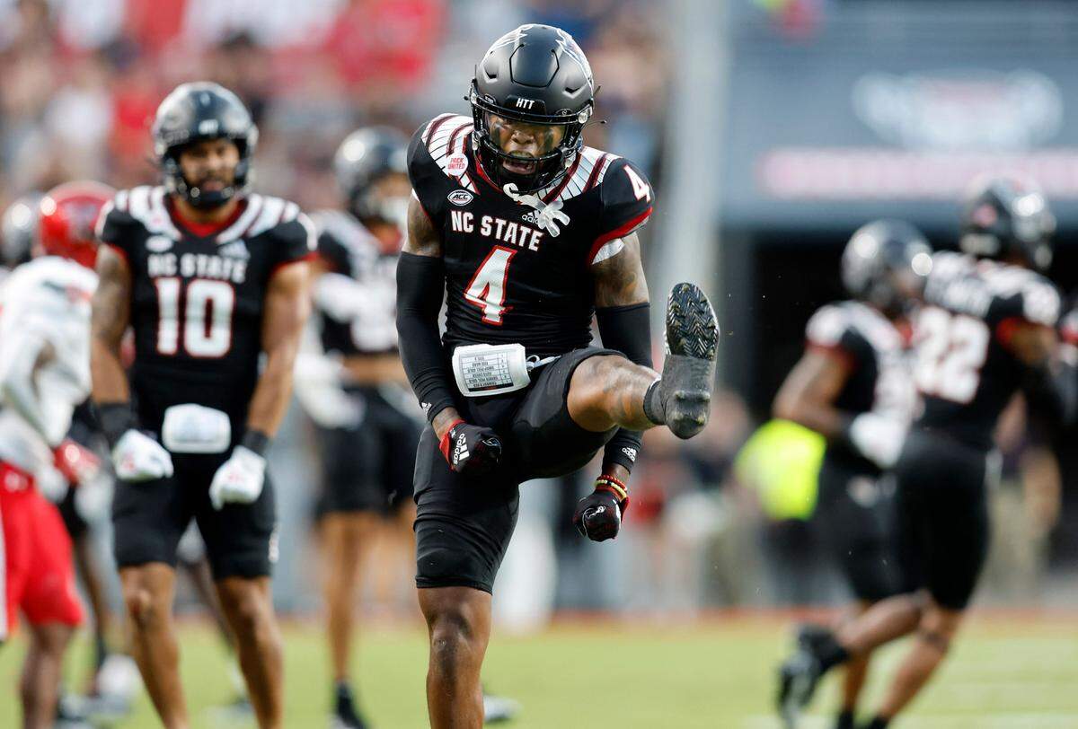 N.C. State safety Cyrus Fagan (4) celebrates after breaking a Texas Tech pass during the first half of N.C. State’s game against Texas Tech at Carter-Finley Stadium in Raleigh, N.C., Saturday, Sept. 17, 2022.