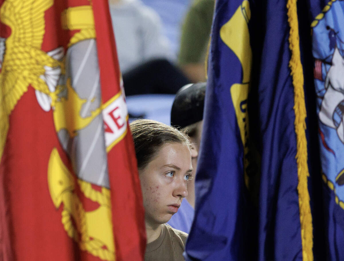 A person listens to remarks prior to a memorial stair climb at Kenan Memorial Stadium on Sept. 11, 2025, held to honor those who lost their lives during the attacks of Sept. 11, 2001.