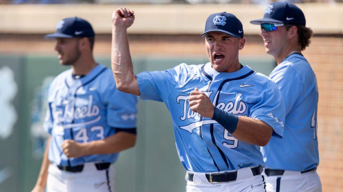 North Carolina catcher Eric Grintz (5) reacts after a game saving catch by teammate centerfielder Vance Honeycutt (7) in the bottom of the ninth inning, enabling the Tar Heels to secure a 6-5 victory over Georgia on Sunday, June 5, 2022 at Boshamer Stadium in Chapel Hill, N.C.