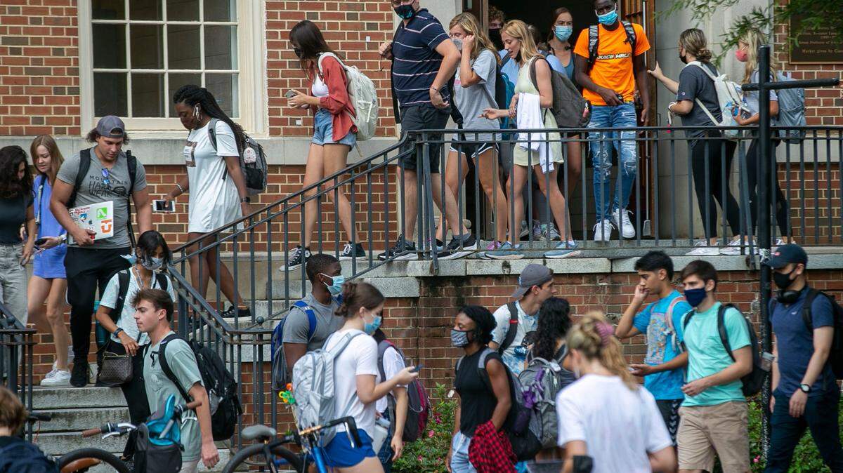 University of North Carolina students file out of Dey Hall on the Chapel Hill campus in this file photo taken August 18, 2021 in Chapel Hill, N.C.