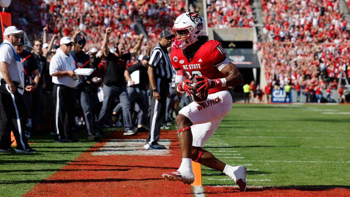 N.C. State wide receiver KC Concepcion (10) scores on a nine-yard touchdown reception during the first half of N.C. State’s game against Clemson at Carter-Finley Stadium in Raleigh, N.C., Saturday, Oct. 28, 2023.