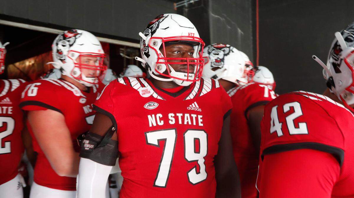 N.C. State offensive tackle Ikem Ekwonu (79) gets ready to head out onto the field before N.C. State’s game against Syracuse at PNC Arena in Raleigh, N.C., Saturday, Nov. 20, 2021.