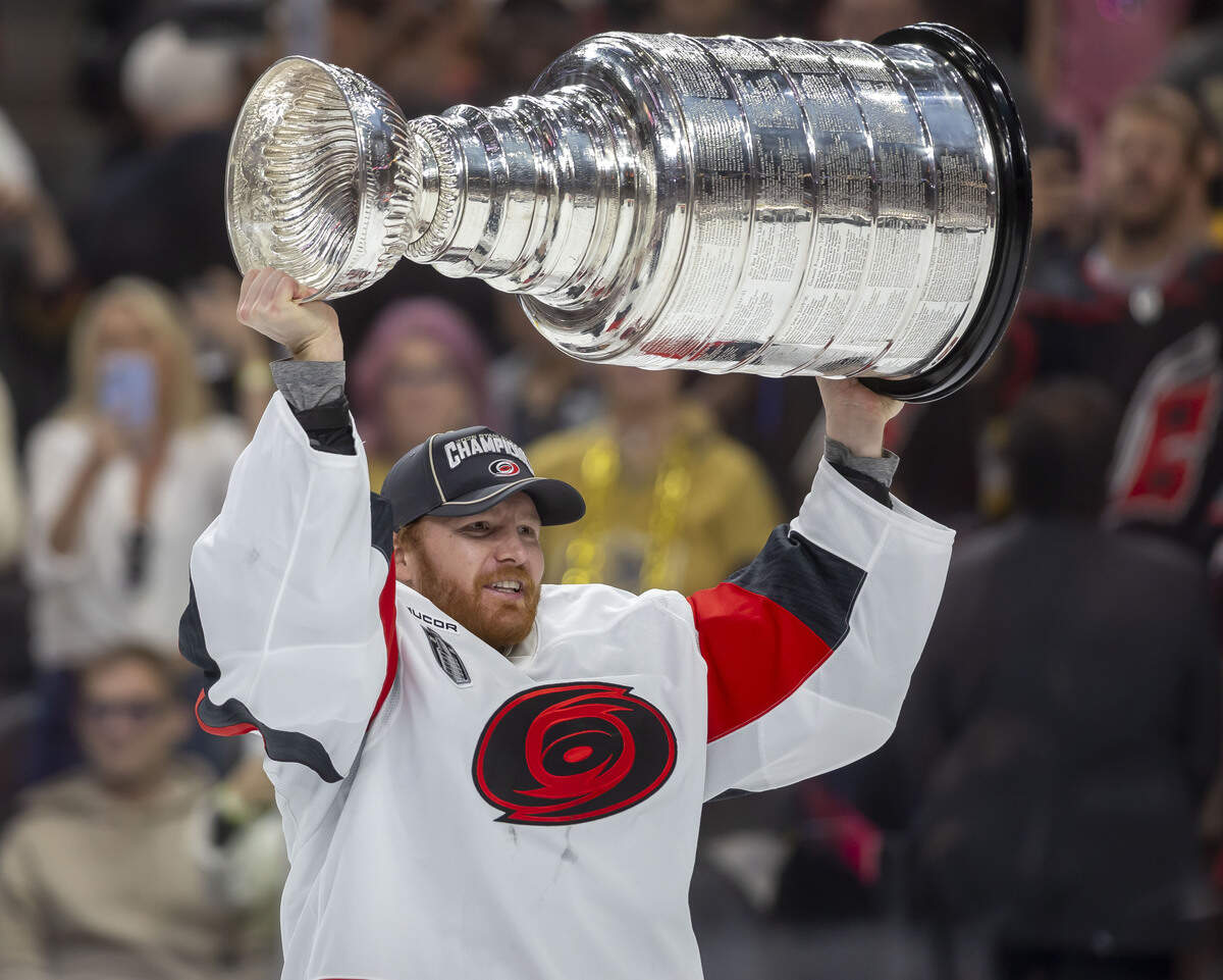 Carolina Hurricanes captain Jordan Staal (11) handed the Stanley Cup to goalie Frederik Andersen (31), after defeating the Vegas Golden Knights 3-0 in Game 6 on Sunday, June 14, 2026 at T-Mobile Arena in Las Vegas, NV. Andersen lead the Hurricanes through the playoffs until he was pulled in Game 3 of the Stanley Cup Final.