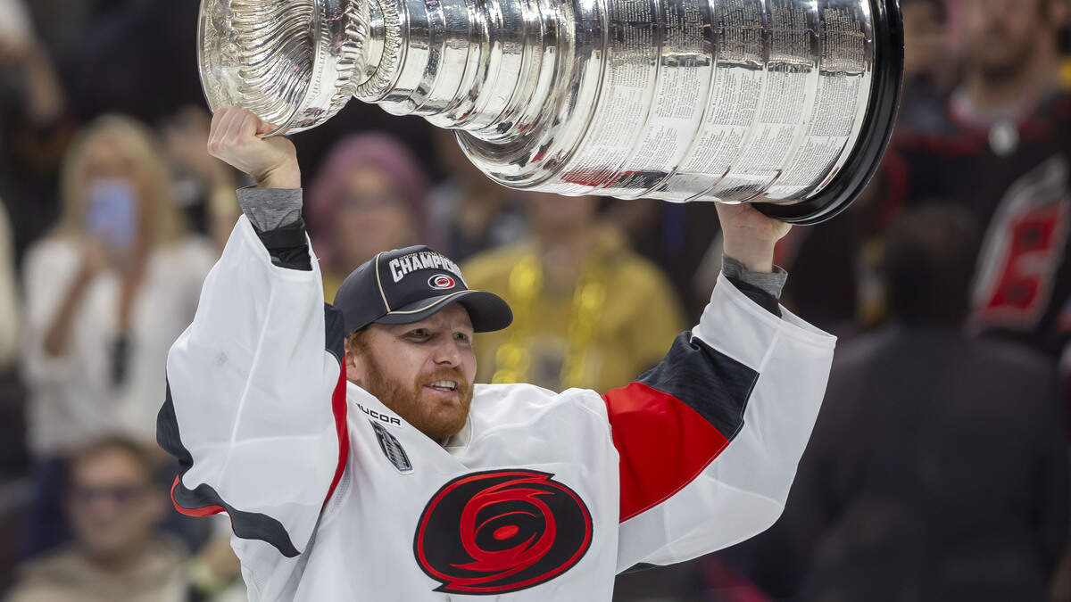 Carolina Hurricanes captain Jordan Staal (11) handed the Stanley Cup to goalie Frederik Andersen (31), after defeating the Vegas Golden Knights 3-0 in Game 6 on Sunday, June 14, 2026 at T-Mobile Arena in Las Vegas, NV. Andersen lead the Hurricanes through the playoffs until he was pulled in Game 3 of the Stanley Cup Final.