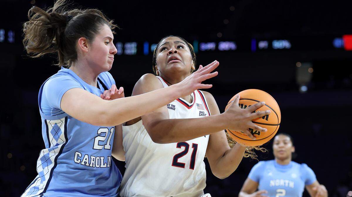 Sarah Strong (21) of the UConn Huskies drives to the basket against Ciera Toomey of UNC during the third quarter of the teams’ NCAA Women's Basketball Tournament Sweet 16 game at Dickies Arena on March 27, 2026 in Fort Worth, Texas.
