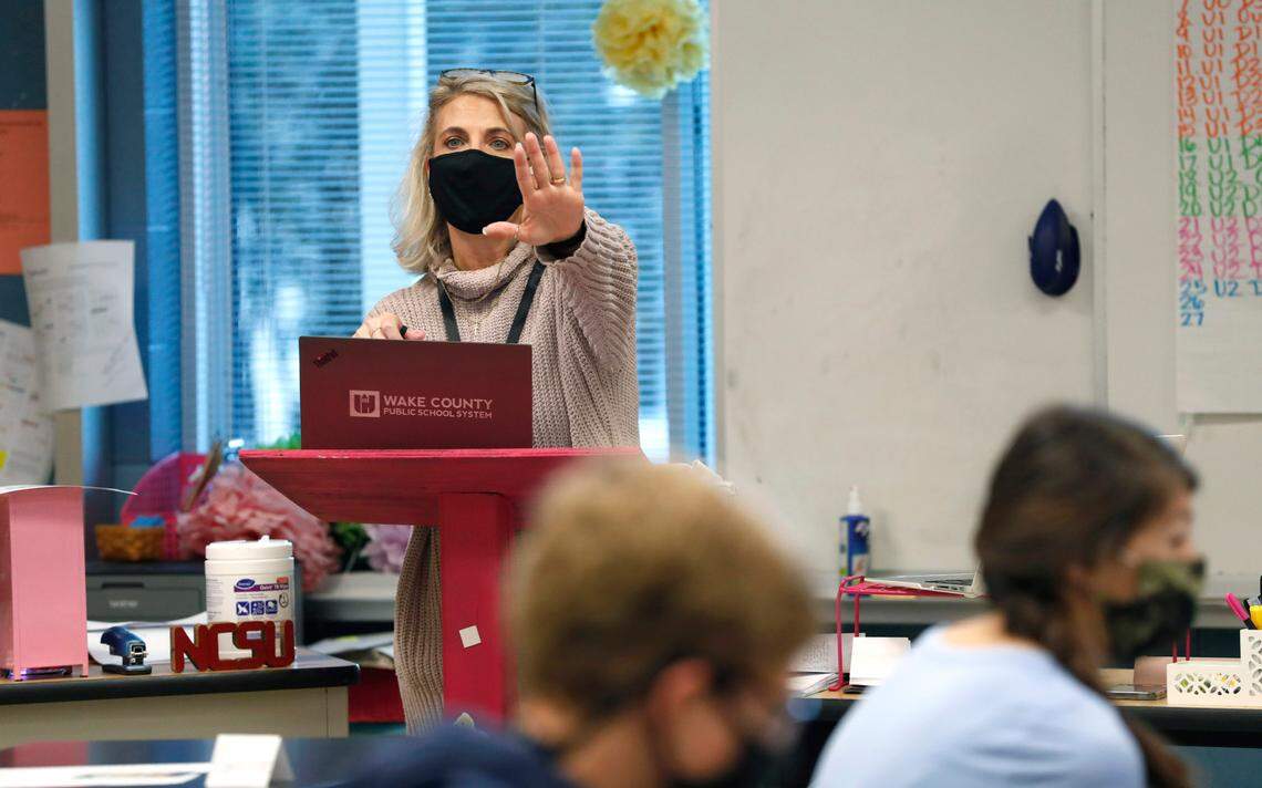Michele Jones teaches students online and in class during her pre-calculus blended class at Millbrook High School Wednesday morning, February 17, 2021. Wake County say high school end-of-course results from the fall 2021 semester are up compared to the fall 2020 semester.