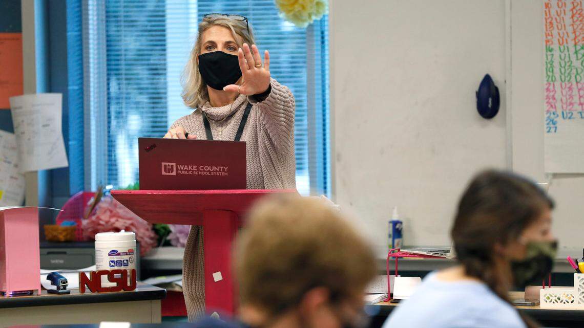Michele Jones teaches students online and in class during her pre-calculus blended class at Millbrook High School Wednesday morning, February 17, 2021. Wake County say high school end-of-course results from the fall 2021 semester are up compared to the fall 2020 semester.
