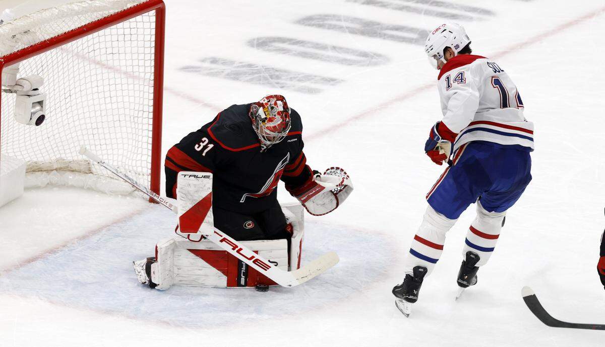 Carolina's Frederik Andersen (31) stops the shot by Montréal's Nick Suzuki (14) in the second period of the Hurricanes’ game against the Canadiens in game two of the Eastern Conference Finals at the Lenovo Center in Raleigh, N.C., Saturday, May 23, 2026.