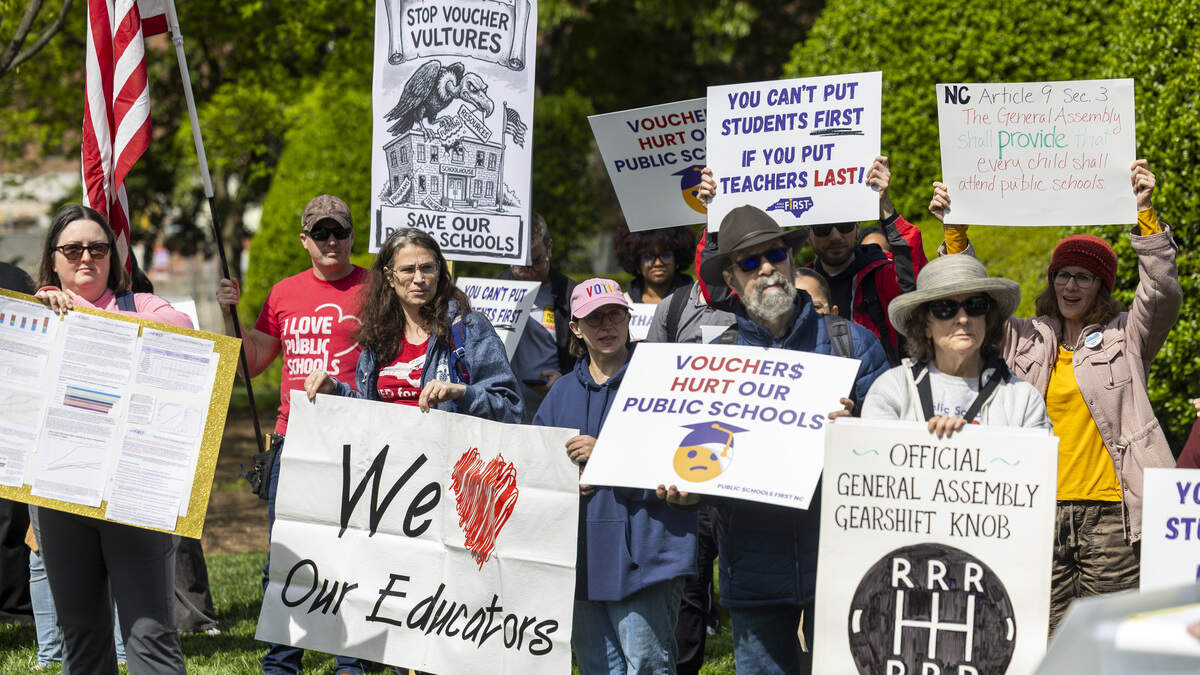 About 50 demonstrators organized by the North Carolina Association of Educators, Public Schools First NC and the North Carolina PTA protest outside the North Carolina Legislative Building on Wednesday, April 8, 2026, during the “wEDnesday for Public Schools” protest over the legislature’s failure to pass a state budget and the North Carolina Supreme Court’s decision to dismiss the long-running Leandro school funding lawsuit and overturn a 2022 court ruling directing the transfer of funds to public schools.