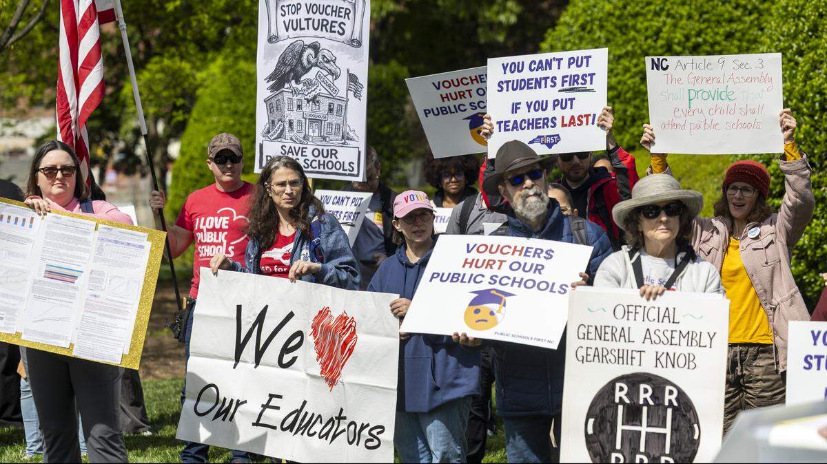 About 50 demonstrators organized by the North Carolina Association of Educators, Public Schools First NC and the North Carolina PTA protest outside the North Carolina Legislative Building on Wednesday, April 8, 2026, during the “wEDnesday for Public Schools” protest over the legislature’s failure to pass a state budget and the North Carolina Supreme Court’s decision to dismiss the long-running Leandro school funding lawsuit and overturn a 2022 court ruling directing the transfer of funds to public schools.