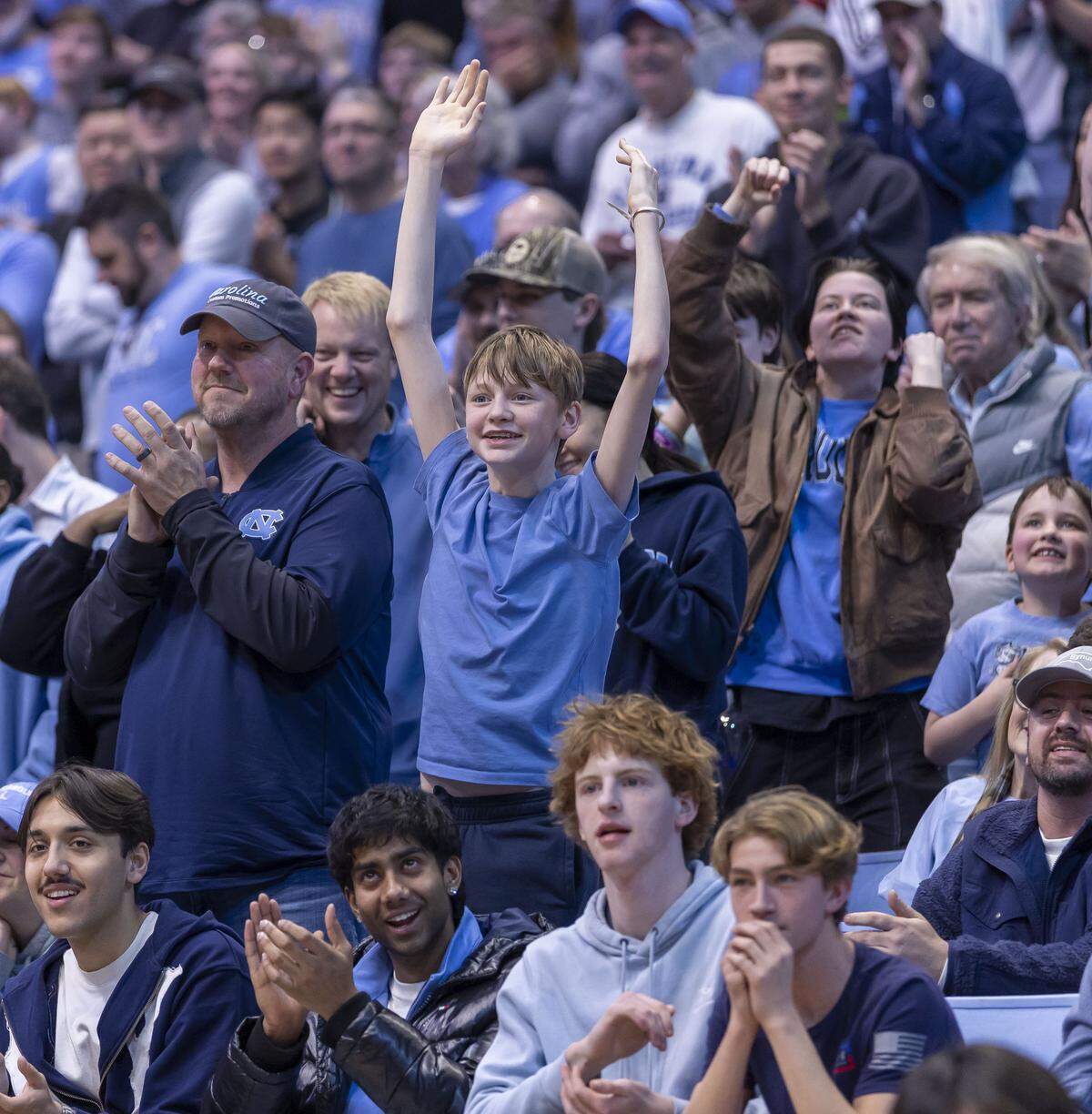 Fans cheers on contestants in a game for $250,000, sponsored by YouTube Influencer MrBeast, following the North Carolina vs USC Upstate on Saturday, December 13, 2025 at the Smith Center in Chapel Hill, N.C.