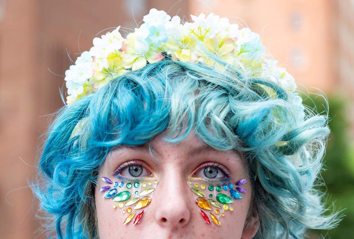Marilyn Broadfoot shows off her rainbow makeup at Raleigh Pride on June, 22, 2024.