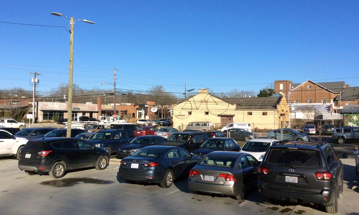 This town-owned parking lot at 203 S. Greensboro St. in Carrboro will be the future home of Orange County’s Southern Branch Library, town Recreation and Parks offices, and a number of smaller civic groups.