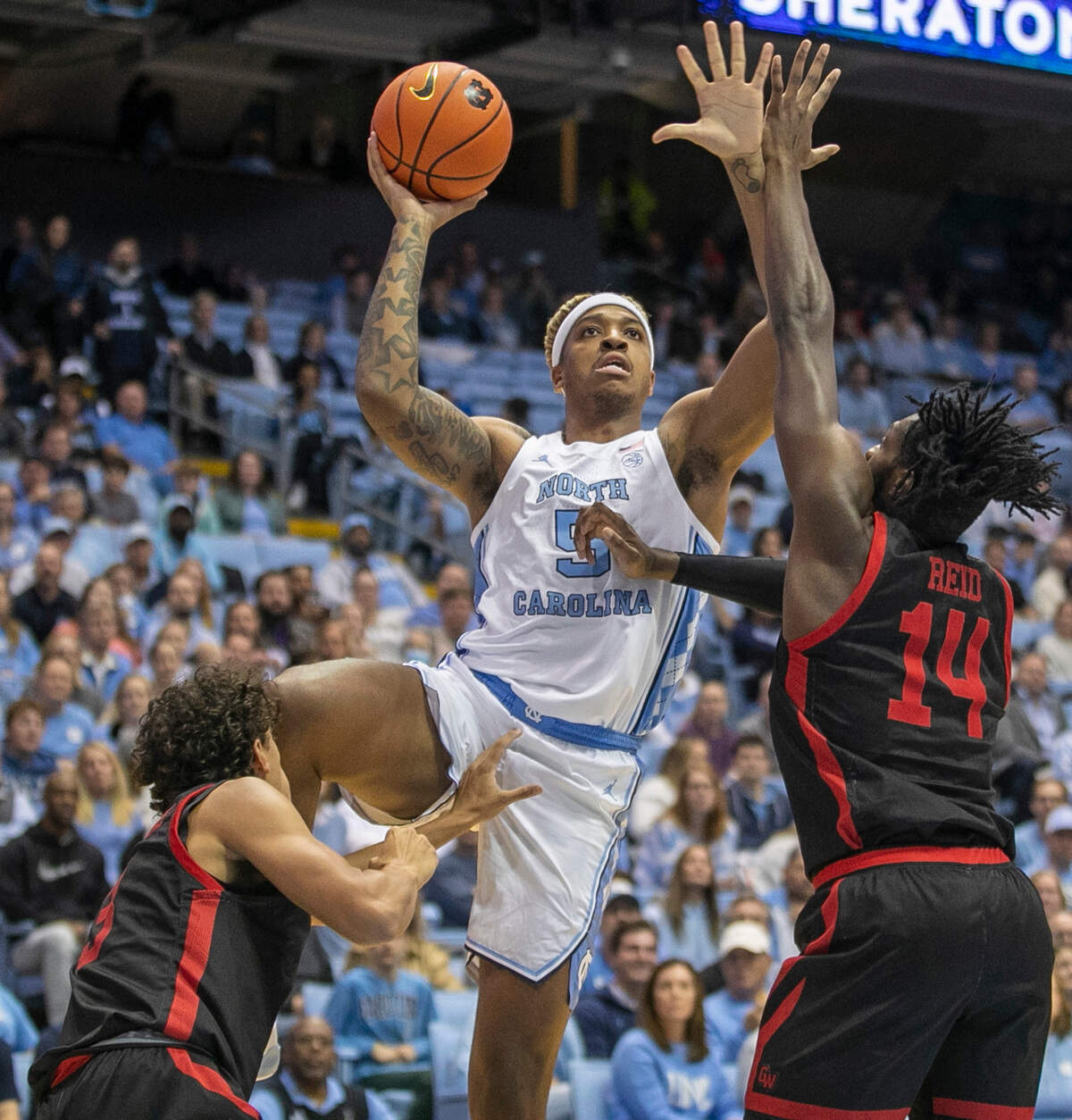 North Carolina’s Armando Bacot (5) puts up a shot against Gardner-Webb’s Kareem Reid (14) during the first half on Tuesday, November 15, 2022 at the Smith Center in Chapel Hill, N.C.