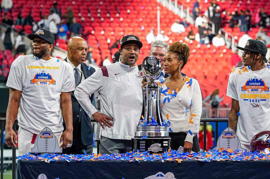 North Carolina Central Eagles head coach Trei Oliver reacts as he accepts the trophy after defeating the Jackson State Tigers to win the Celebration Bowl in overtime at Mercedes-Benz Stadium.