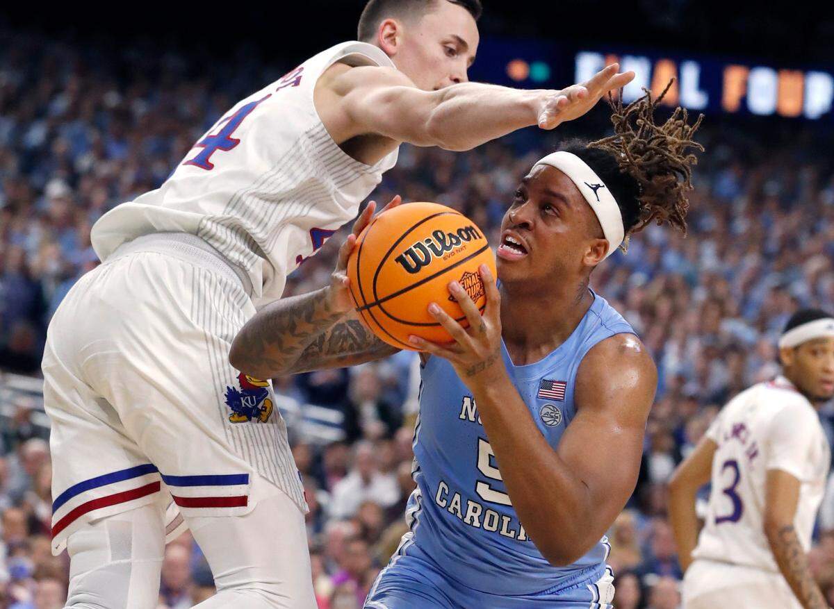 North Carolina’s Armando Bacot (5) heads to shoot as he is about to be fouled by Kansas’ Mitch Lightfoot (44) during the first half of UNC’s game against Kansas in the NCAA Menís National Championship at the Caesars Superdome in New Orleans, La., Monday, April 4, 2022.