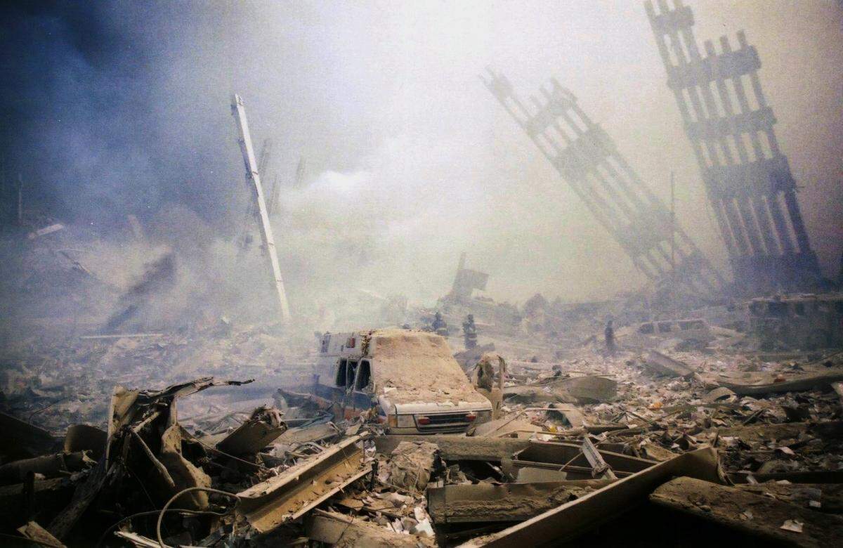Firefighters make their way through the destruction at New York’s World Trade Center after a terrorist attack on the twin towers of lower Manhattan Tuesday, Sept. 11, 2001. In the most devastating terrorist onslaught ever waged against the United States, knife-wielding hijackers crashed two airliners into the World Trade Center on Tuesday, toppling its twin 110-story towers.