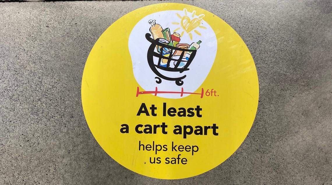 A floor decal at the Wegmans grocery store in Raleigh notes the recommended 6-foot social distancing practice in an effort to stop the spread of COVID-19 coronavirus.