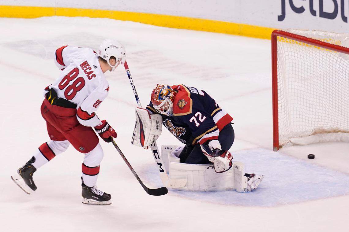 Carolina Hurricanes center Martin Necas (88) scores the winning goal on Florida Panthers goaltender Sergei Bobrovsky (72) in a shootout at an NHL hockey game, Saturday, Feb. 27, 2021, in Sunrise, Fla. The Hurricanes defeated the Panthers 4-3. (AP Photo/Marta Lavandier)