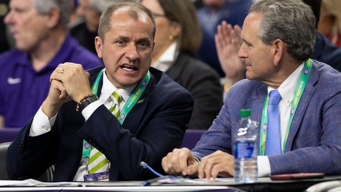 ACC Commissioner Jim Phillips talks with North Carolina Athletic Director Bubba Cunningham during the NCAA Tournament game between North Carolina and Duke at Caesars Superdome in New Orleans, La. on Saturday April 2, 2022.
