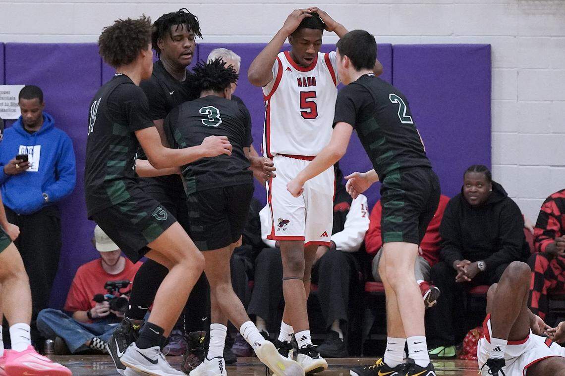Coronado's DeVaughn Dorrough (5) reacts to the charge call while Greenfield players celebrate during the second half. The Greenfield Knights and the Coronado Cougars (Nevada) met in the finals of the Day'Ron Sharpe bracket of the  John Wall Holiday Tournament in Raleigh, N.C. on December 30, 2025.
