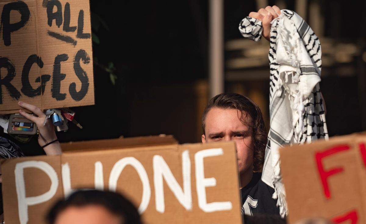 People gather to share statements at the Peace and Justice Plaza outside the courthouse regarding the charges against pro-Palestine protesters and broader beliefs about the war on Tuesday, July 30, 2024.