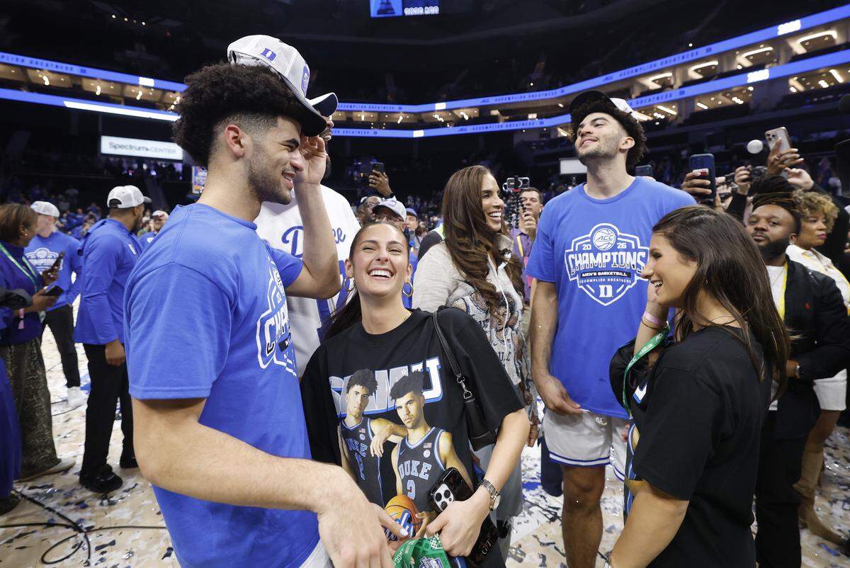 Duke’s Cayden Boozer and Cameron Boozer celebrate after Duke’s 74-70 victory over Virginia in the finals of the 2026 ACC Men’s Basketball Tournament at the Spectrum Center in Charlotte, N.C., Saturday, March 14, 2026.